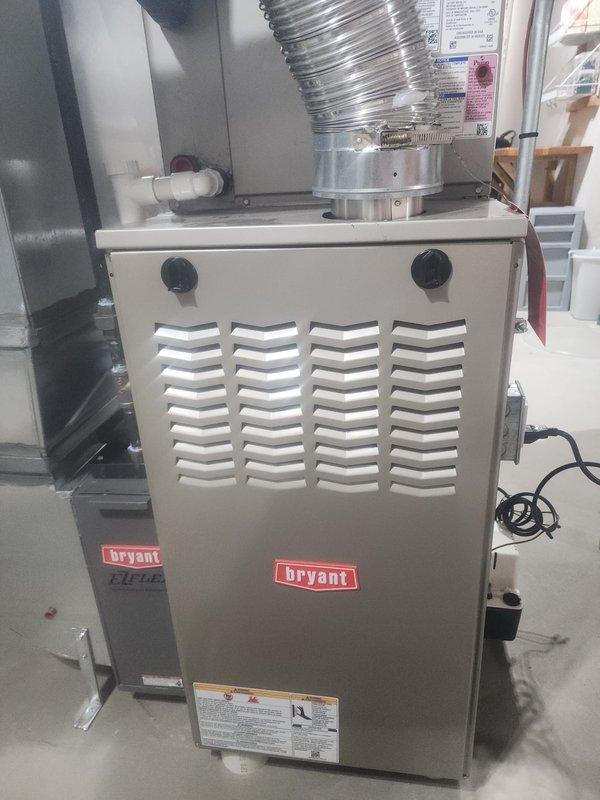 Responded to service call for a Bryant EI-Plus furnace with water leakage and no heat production. Performed diagnostic inspection of internal components including circuit board, blower motor assembly, and pressure switches. Resolved condensate drainage issue from the PVC piping system and restored proper heating functionality.