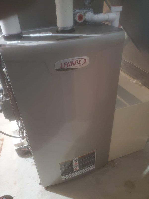 Performed routine maintenance on Lennox heating system under Worry Free Service Agreement. Conducted thorough inspection of internal components including blower assembly, circuit board, and electrical connections. Documented system condition with photos showing proper installation of ventilation piping and confirmed unit is operating within manufacturer specifications.