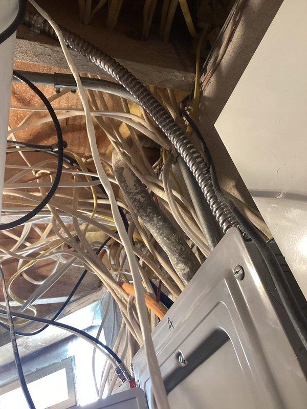 Completed installation of a 60-amp rated 240V circuit for an EV charging station in the garage, including a GFCI-protected 50-amp receptacle surface-mounted on the back wall near existing fixtures. Circuit runs with copper conductors from the main service panel, and all work was completed with proper permitting and passed inspection as evidenced by approval sticker. Additionally installed two customer-supplied Z-wave switches for patio heater and diagnosed power loss to basement receptacle.