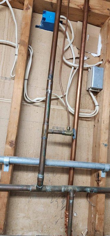 Completed routine furnace maintenance service, inspecting copper refrigerant lines, electrical connections, and system components. Examined junction boxes and verified proper installation of supply lines and conduits. System is functioning within normal parameters after service.