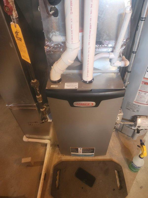 Performed scheduled prepaid maintenance on Lennox furnace system. Inspected internal control board components including circuit board connections, wiring integrity, and fan motor assembly. Examined ventilation system including PVC exhaust pipes and connections, ensuring proper installation and function of the complete heating system.