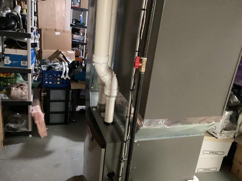 Successfully installed a Lennox furnace with S40 thermostat, humidifier, and Air Scrubber in the basement utility area. Completed all necessary connections including PVC drainage system and ductwork, ensuring proper installation of all components. Customer utilized financing option for the service.