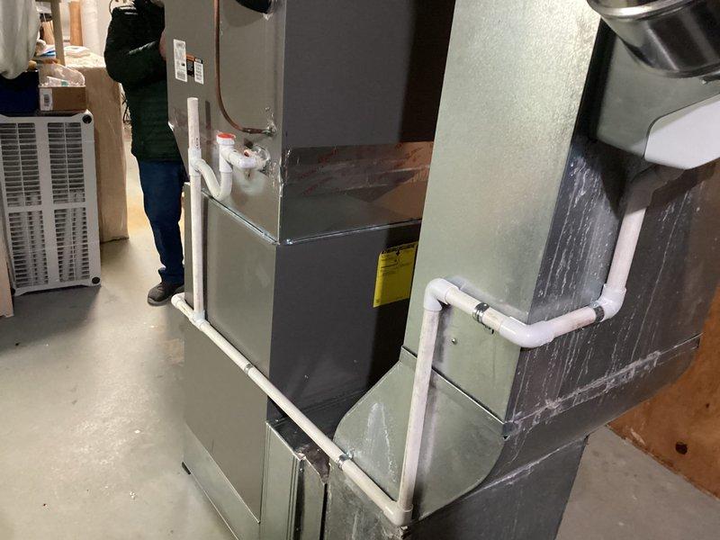 Successfully installed a Lennox furnace with S40 thermostat, humidifier, and Air Scrubber in the basement utility area. Completed all necessary connections including PVC drainage system and ductwork, ensuring proper installation of all components. Customer utilized financing option for the service.