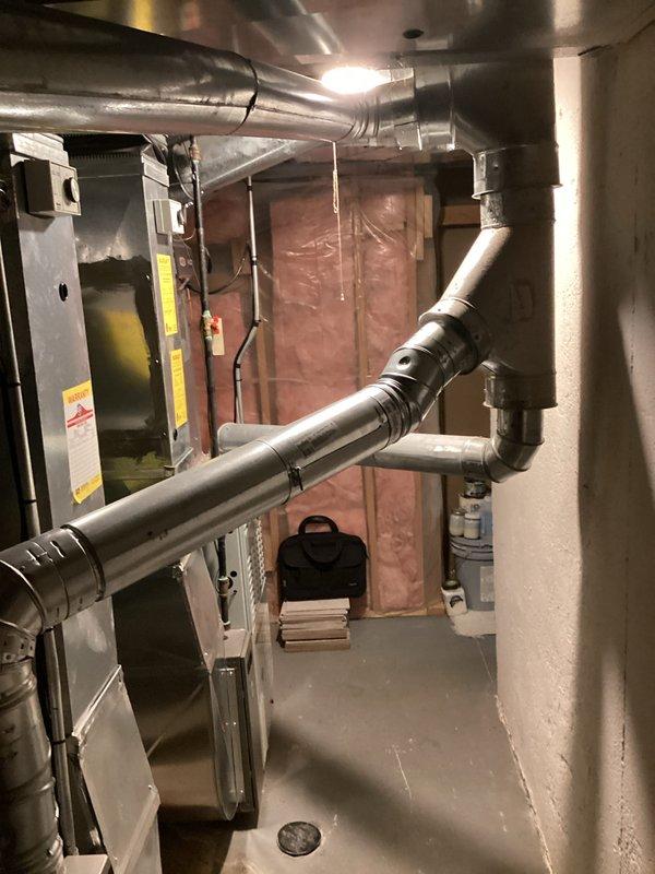 Conducted a comprehensive inspection and estimate for replacement of existing Carrier furnace system located in basement utility area. Assessment included examination of current ductwork configuration, connections, and overall system condition. Documented existing installation with photos to support replacement recommendation, noting the current system's specifications and connection points to facilitate accurate equipment sizing and installation planning.
