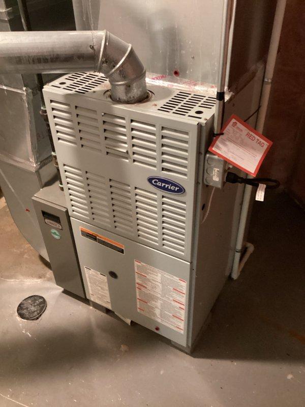 Conducted a comprehensive inspection and estimate for replacement of existing Carrier furnace system located in basement utility area. Assessment included examination of current ductwork configuration, connections, and overall system condition. Documented existing installation with photos to support replacement recommendation, noting the current system's specifications and connection points to facilitate accurate equipment sizing and installation planning.