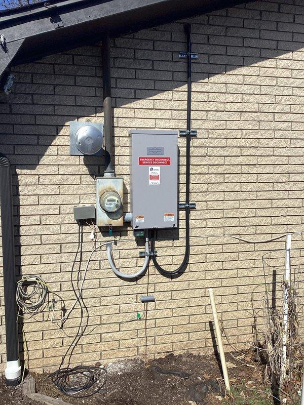 Completed installation of Briggs & Stratton 18kW generator and 150-amp transfer switch on residential property. Mounted transfer switch on exterior wall adjacent to utility meter, configured for whole-house backup capability. Customer was advised to contact gas utility for required meter upgrade to support generator fuel requirements.