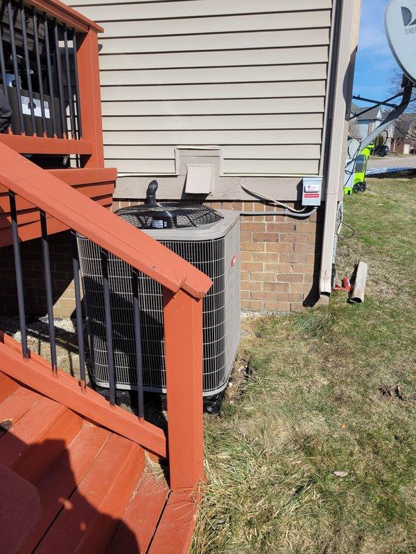 Successfully installed a complete Bryant HVAC system including furnace, air conditioner, and humidifier at residential property. Implemented Add-A-Wire solution to ensure compatibility with customer's Nest thermostat. Properly positioned outdoor condenser unit on concrete pad beneath deck with appropriate clearances for optimal airflow and performance.