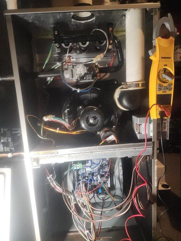 Performed routine maintenance on Bryant furnace system. Investigated customer-reported faint whining noise using Fieldpiece diagnostic tools on electrical components and blower motor assembly. Completed full inspection of internal components including circuit board connections and ventilation system; unit is functioning within normal parameters.