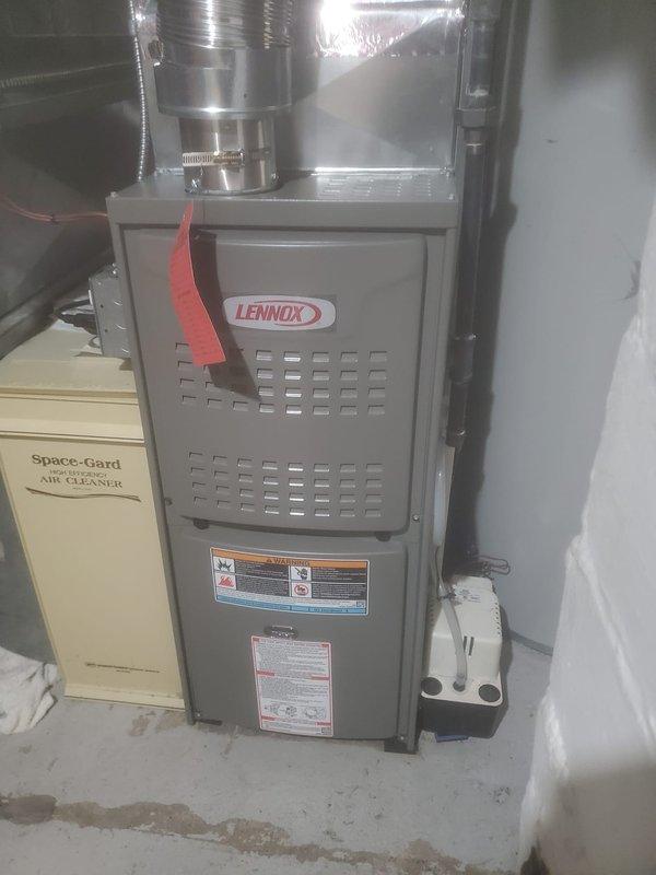 Completed annual furnace maintenance on Lennox gas heating system. Inspected internal components including blower motor, gas valve assembly, control board, and associated wiring connections. System includes a Space-Gard Air Cleaner unit. All components were found to be in working condition.