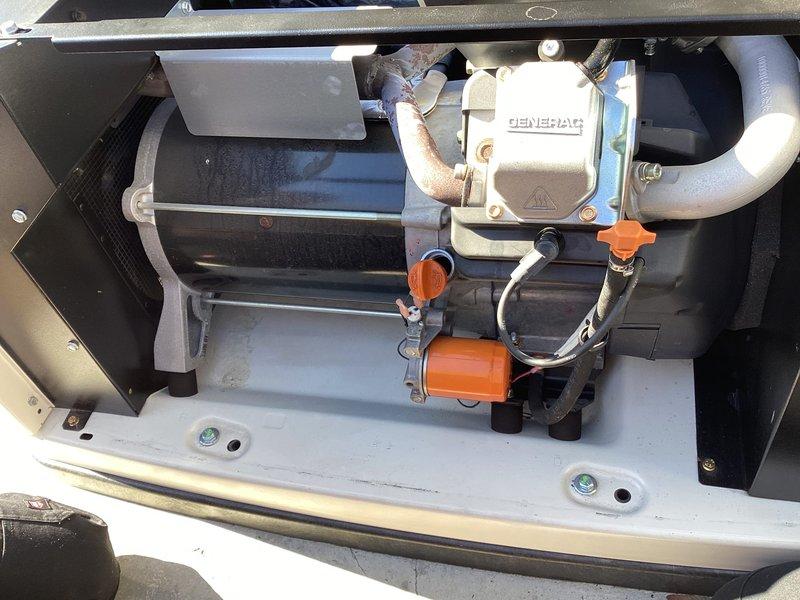 Performed scheduled generator maintenance service on Generac unit. Conducted electrical testing with multimeter probe on control components and inspected all connections. Verified proper operation of fuel system including valve positions and checked all mounting hardware for tightness.