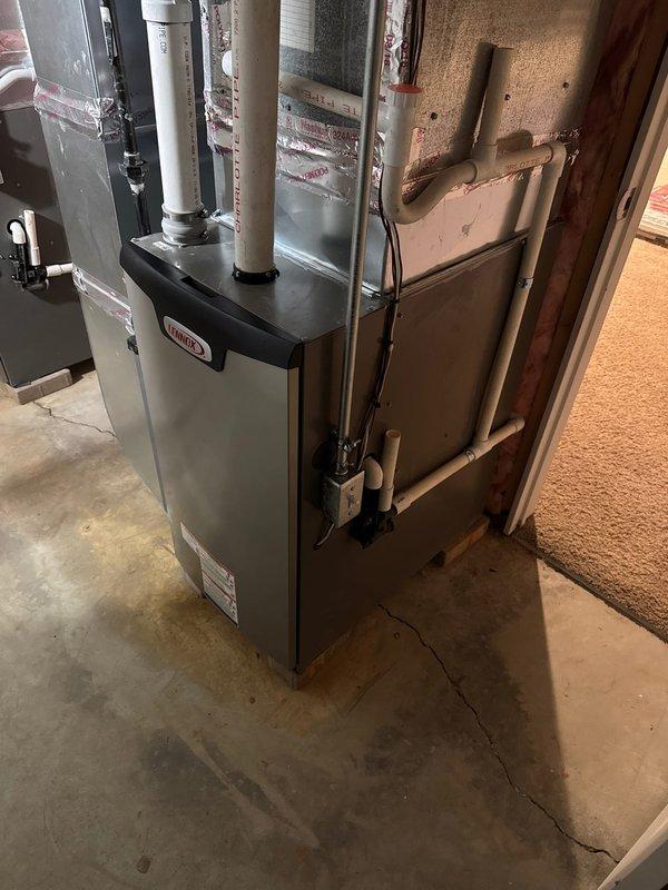 Successfully completed installation of dual Lennox furnaces with S40 thermostats and humidifiers in basement utility area. All units were properly mounted on concrete floor with PVC ventilation pipes correctly routed, and all connections to existing ductwork were secured. System was tested and verified operational with proper documentation completed.