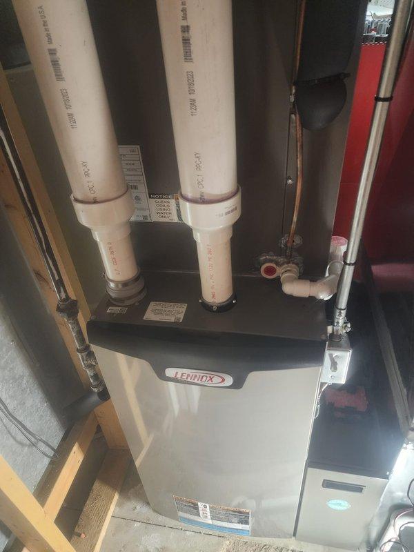 Completed scheduled maintenance on a 3-year-old Lennox furnace under Worry Free Service Agreement. Performed comprehensive heating system tune-up including inspection of internal components, blower motor, control board, and electrical connections. System is functioning properly with no issues identified; unit is properly vented with PVC exhaust and intake pipes in good condition.