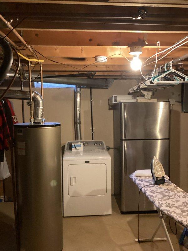 Conducted comprehensive evaluation of 20+ year old HVAC system in residential property, documenting obsolete furnace in basement and aging central air unit in backyard. Provided replacement estimate for complete system upgrade, noting current equipment has exceeded typical service lifespan and replacement would improve energy efficiency and reliability.