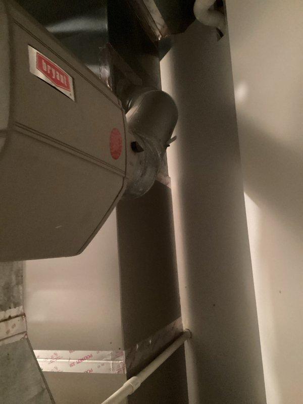 Completed assessment and generated estimate for boiler and furnace replacement. System installation includes primary HVAC unit with properly connected ductwork, sealed metal joints, and PVC condensate drainage/ventilation piping. Complete heating and cooling system features standard components in functional configuration with all necessary electrical connections.