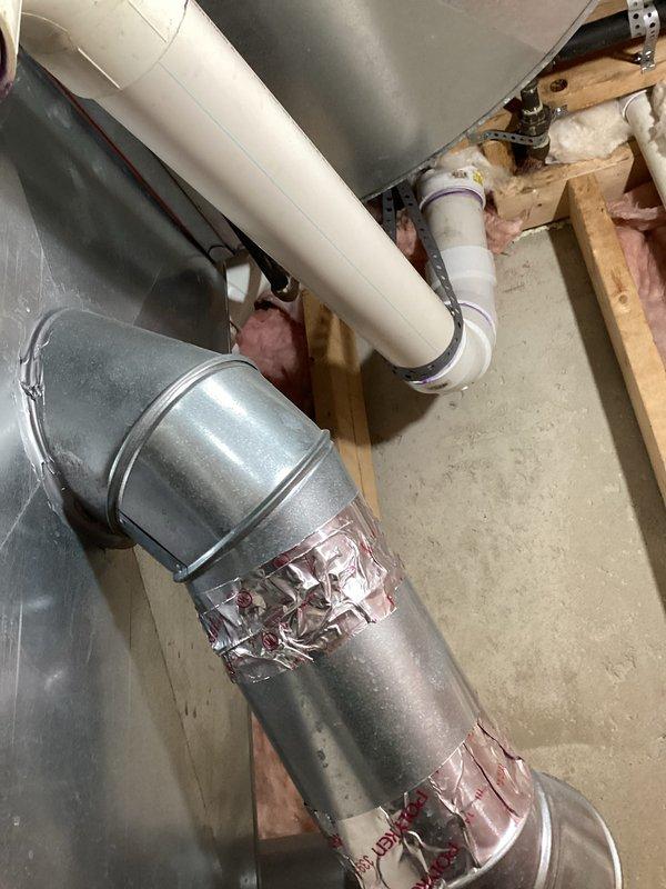 Completed HVAC system replacement with installation of new Haier unit in utility area. Installed proper ductwork with sealed metal tape at seams and connected PVC condensate drainage system with appropriate horizontal and vertical runs. All components were properly secured and insulated, with system tested for optimal functionality.