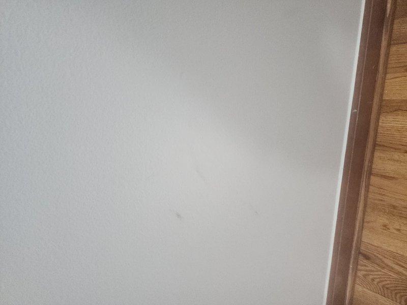 Responded to call back regarding hole in furnace from previous humidifier installation and wall marks near thermostat. Inspected junction box installation and surrounding area, documenting visible wiring and mounting configuration. Noted minor surface marks on interior wall near wooden trim that appeared to be fingerprints as reported by customer.