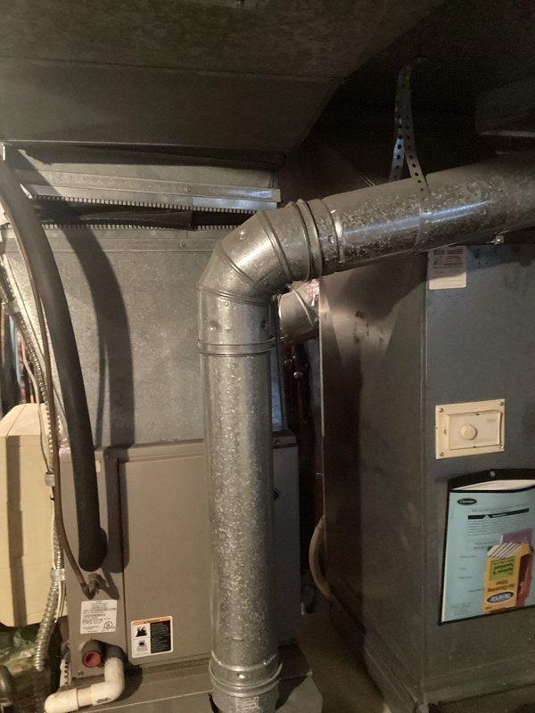 Conducted comprehensive evaluation of two aging HVAC systems, both exceeding 20 years of service life. Performed ignitor repair on existing unit to restore functionality while customer considers full system replacement options. Documented current installation configuration including ductwork, furnace/air handler unit, and associated components for replacement proposal.