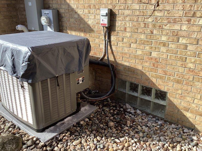 Installed protective cover on outdoor condenser unit as requested. Unit is properly mounted on concrete pad with appropriate electrical connections to disconnect box. Documented installation with photos showing completed work.