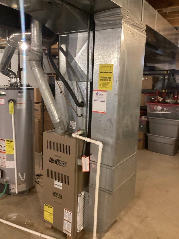 Conducted comprehensive assessment of existing UltraPro furnace system in partially finished basement. Provided detailed replacement estimate (Quote #03817-03 and #03817-02) for furnace replacement, documenting current installation configuration including ductwork connections, drainage system, and proximity to water heater. Photos taken of complete HVAC setup to support accurate estimation for "Furnace est3-4p" proposal.