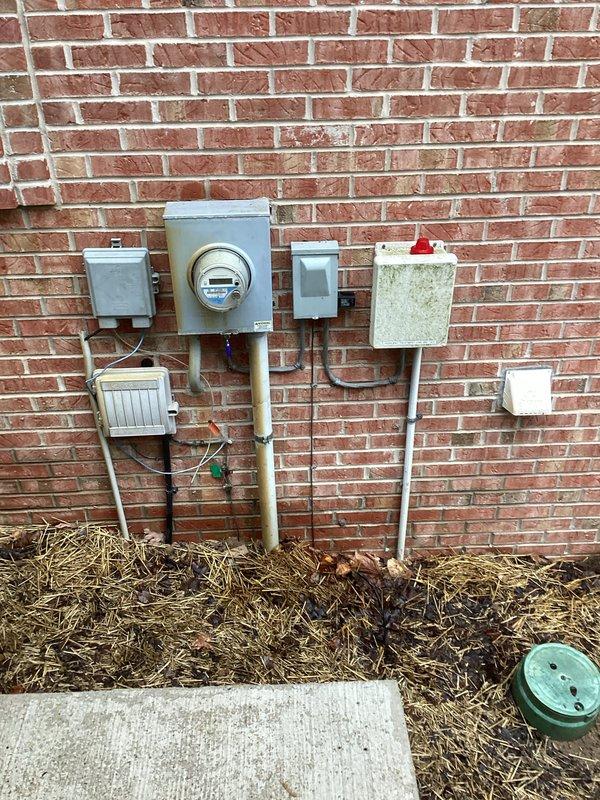 Conducted site assessment for generator installation and potential garage unit heater. Documented existing electrical infrastructure including main meter setup, junction boxes, and conduit configuration. Also inspected gas regulator system to evaluate compatibility with proposed generator installation.