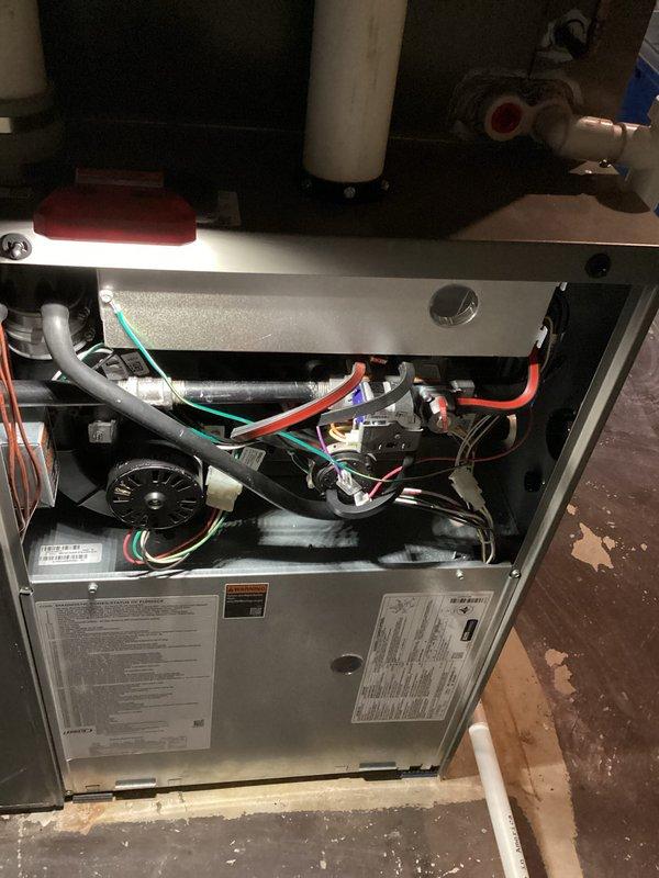 Performed comprehensive maintenance on Lennox furnace system. Inspected interior components including blower motor, wiring connections and control board - all found in normal working condition. Verified proper installation of PVC venting/drainage system and confirmed operational status of all system components.