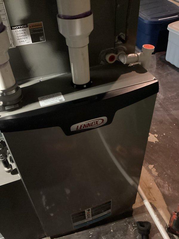 Performed comprehensive maintenance on Lennox furnace system. Inspected interior components including blower motor, wiring connections and control board - all found in normal working condition. Verified proper installation of PVC venting/drainage system and confirmed operational status of all system components.
