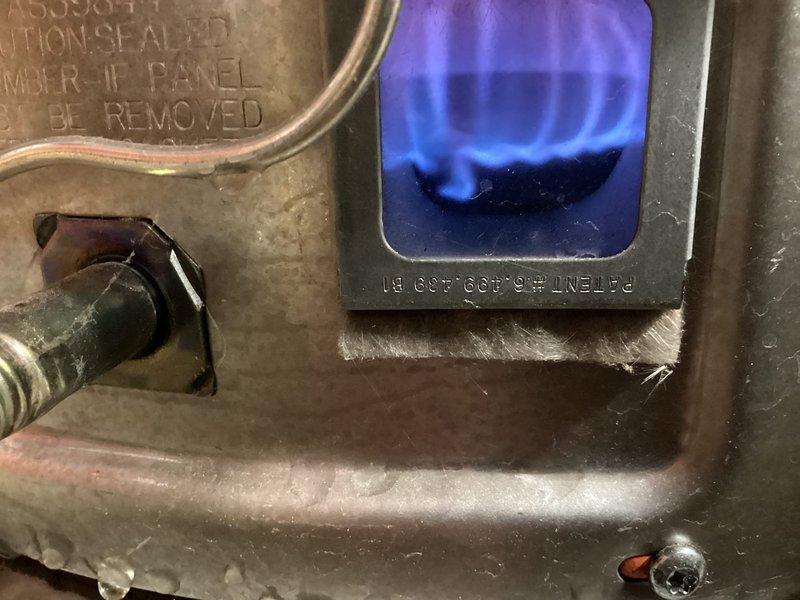 Completed follow-up inspection on failed furnace installation. Replaced entire furnace exhaust system with Schedule 40 PVC (ASTM 2665) and installed hammer arrester to water supply line. Verified proper combustion with blue flame pattern indicating normal operation.