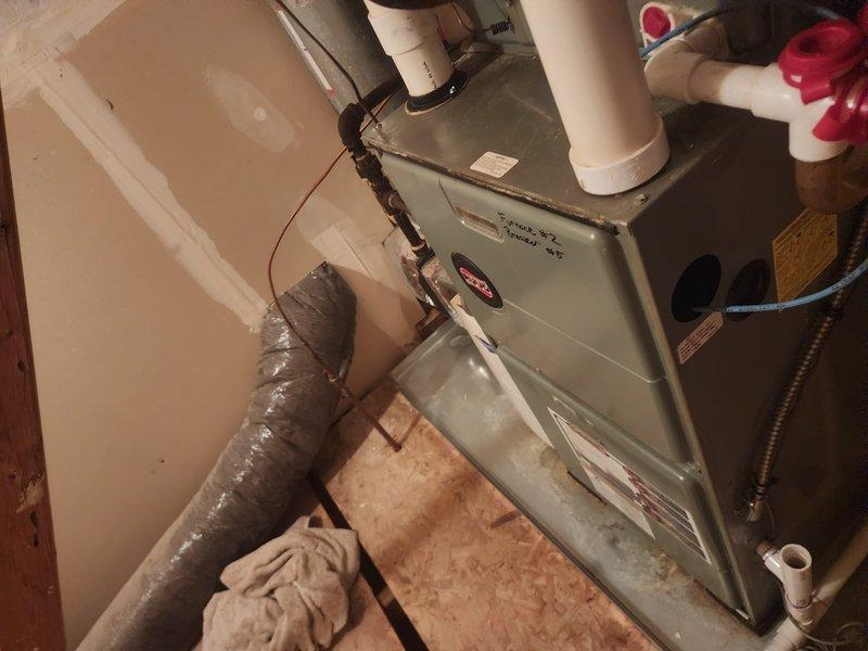 Completed scheduled maintenance service on two residential HVAC systems: a standard furnace unit installed in a utility area with PVC ventilation pipes and flexible insulated ducting, and a Bryant dual-cabinet system with proper ventilation connections. Both systems were inspected, cleaned, and tested according to manufacturer specifications, ensuring optimal heating performance for the upcoming season.