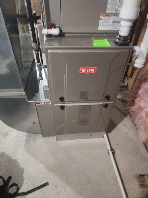 Completed scheduled maintenance service on two residential HVAC systems: a standard furnace unit installed in a utility area with PVC ventilation pipes and flexible insulated ducting, and a Bryant dual-cabinet system with proper ventilation connections. Both systems were inspected, cleaned, and tested according to manufacturer specifications, ensuring optimal heating performance for the upcoming season.