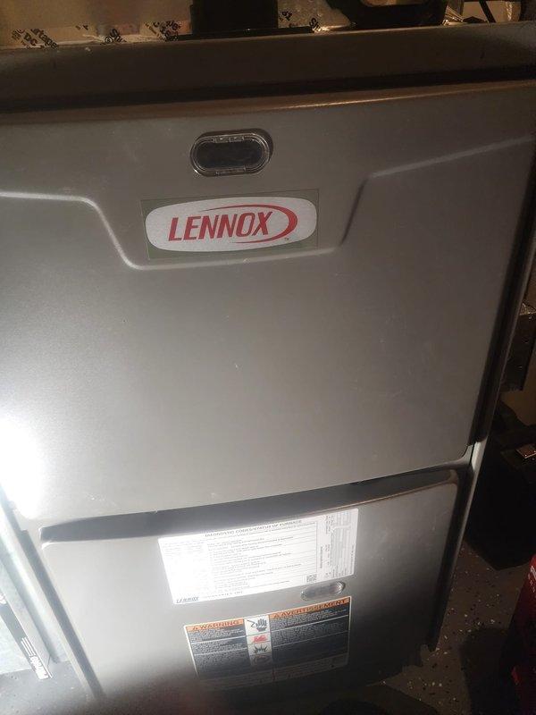 Performed annual maintenance service on Lennox furnace, which included inspection of control board and electrical connections. Removed access panel to examine interior components and verified proper wiring integrity. System is operating within normal parameters with no immediate concerns identified.