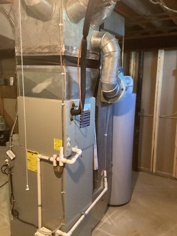 Completed HVAC replacement quote (CQ Quote: 03829-01 FRN Only11A-1P) for residential basement installation. System includes new furnace with PVC condensate drainage, galvanized sheet metal ductwork with proper connections to existing distribution system, and coordination with adjacent water heater placement for optimal mechanical room layout.