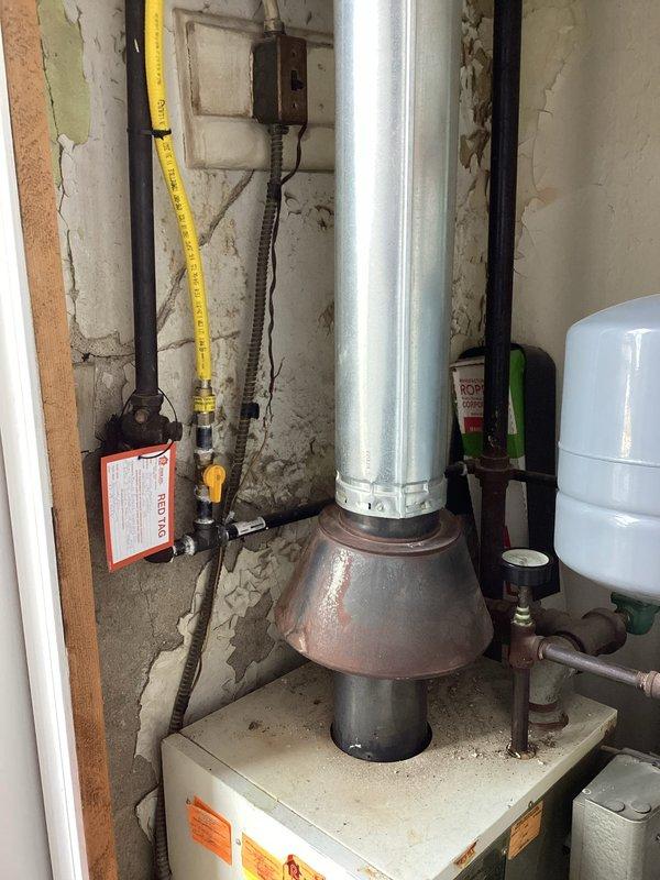 Performed CSD1 annual boiler inspection on Unit 112, including combustion analysis with Bacharach analyzer confirming proper natural gas readings (15.5% O2, 70 ppm CO, 87.5% efficiency, 3.0% CO2). Visual inspection revealed aging infrastructure with deteriorating wall conditions around the boiler installation and some surface rust on copper components; documented with photos for reference.