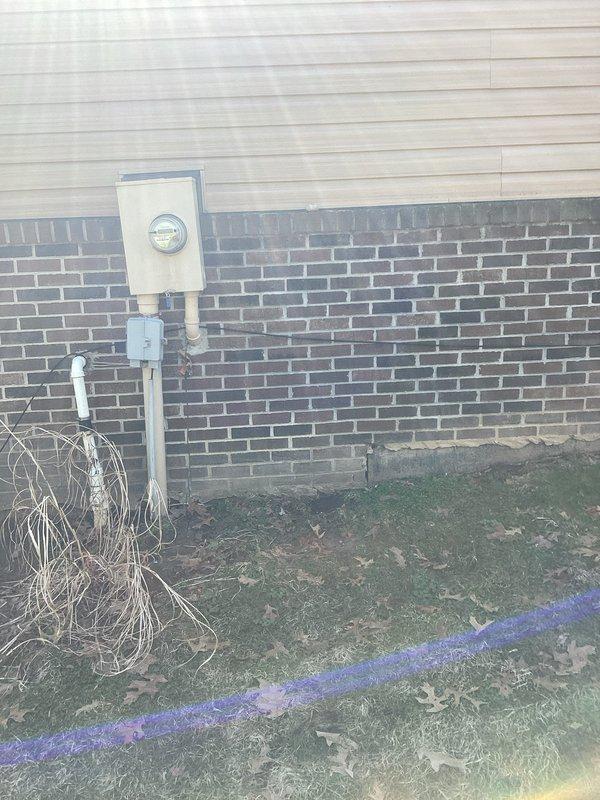 Conducted comprehensive site assessment for whole-house generator installation, including evaluation of existing electrical service entrance, utility meter configuration, and potential mounting locations. Documented current electrical infrastructure with particular attention to the Crouse-Hinds equipment panel to determine proper generator sizing and connection requirements for this residential property.