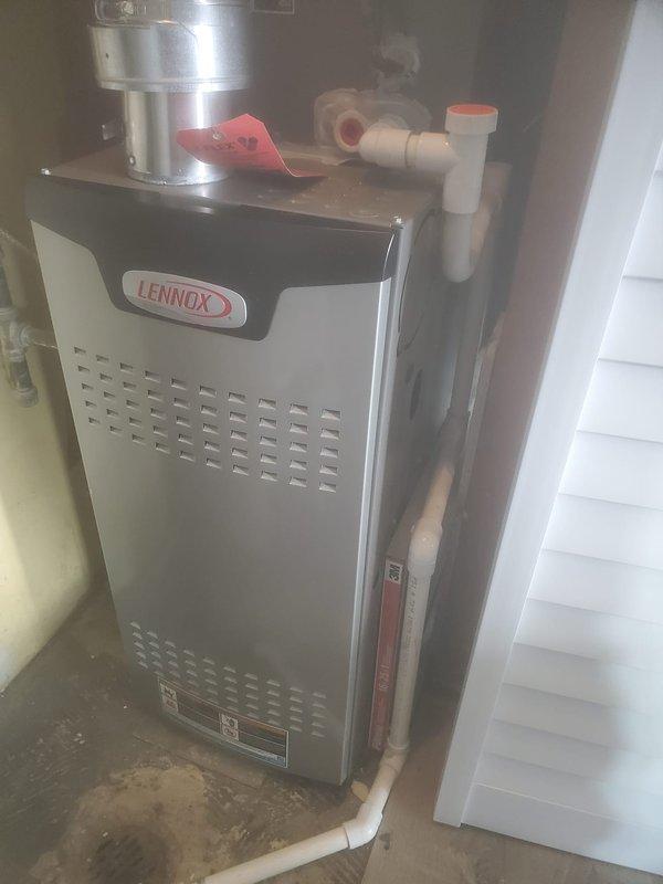 Performed scheduled maintenance on Lennox furnace under FRN maintenance agreement. Removed access panels to inspect and clean internal components including blower wheel, circuit boards, and electrical connections. Verified proper operation of exhaust/intake system and condensate drainage; attached service tag upon completion.