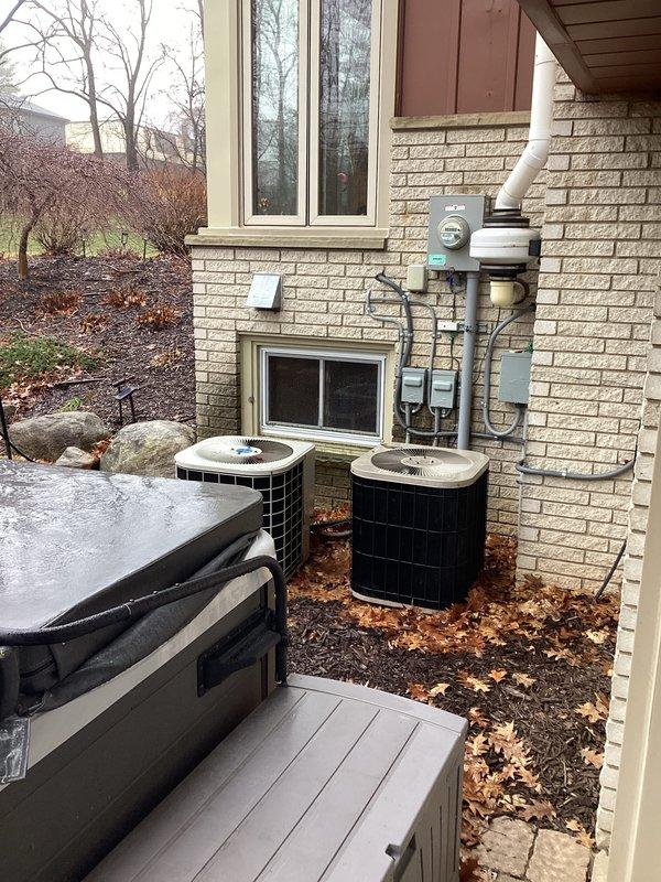 Completed replacement of two full HVAC systems (CQ Quote: 03838-01 and 03838-02) at residential property. Installation included new Trane air handler with filtration system in utility area, connected with appropriate ductwork, electrical wiring, and copper refrigerant lines. Both outdoor condensing units were properly positioned on ground level with all necessary electrical connections and PVC exhaust piping.