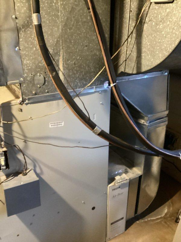 Completed replacement of two full HVAC systems (CQ Quote: 03838-01 and 03838-02) at residential property. Installation included new Trane air handler with filtration system in utility area, connected with appropriate ductwork, electrical wiring, and copper refrigerant lines. Both outdoor condensing units were properly positioned on ground level with all necessary electrical connections and PVC exhaust piping.