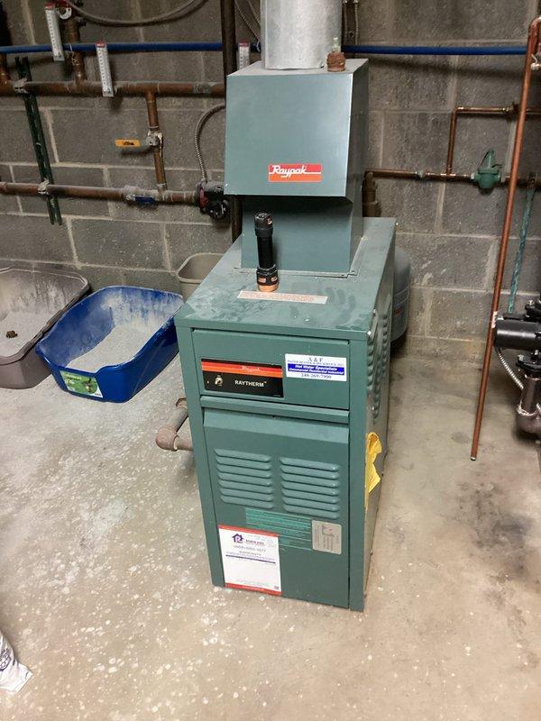 Performed scheduled maintenance on two heating systems: a Raypak Raytherm boiler and a Lennox furnace. Both units were inspected, components checked for proper operation, and systems were verified to be functioning correctly. Documentation completed with photographic records of both heating systems.