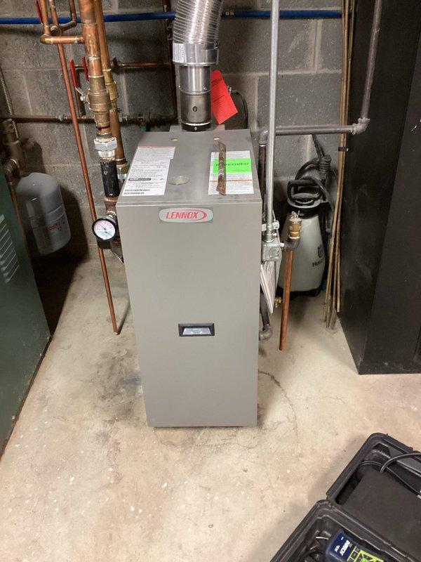 Performed scheduled maintenance on two heating systems: a Raypak Raytherm boiler and a Lennox furnace. Both units were inspected, components checked for proper operation, and systems were verified to be functioning correctly. Documentation completed with photographic records of both heating systems.