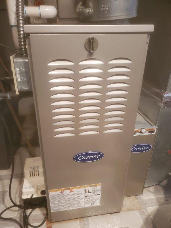 Performed scheduled maintenance on Carrier furnace including full inspection of internal components. Checked blower motor assembly, circuit board connections, and wiring for proper operation. Unit was found to be in normal working condition with no signs of damage or unusual wear.
