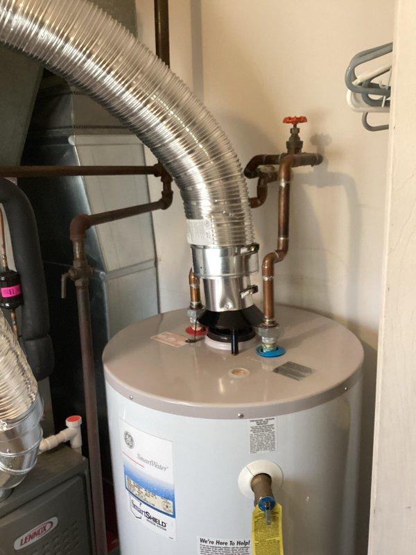 Completed inspection of existing 40-gallon GE SmartWater water heater (CQ Quote: 03847-01) to provide replacement estimate. Unit appears operational with proper inlet/outlet connections and vent piping intact, but approaching end of service life. Documented current installation configuration including copper supply lines, TPR valve, and flue venting system to ensure accurate quote for compatible replacement.