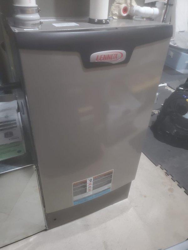 Performed scheduled maintenance on Lennox furnace system. Completed inspection of internal electrical components and wiring connections, ensuring proper operation of motor assembly and control boards. Documented condition of ventilation system including PVC exhaust piping, confirming unit is operating within manufacturer specifications.