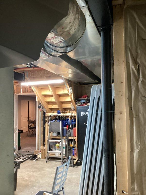 Conducted a comprehensive generator installation assessment in residential basement. Evaluated existing utility area with exposed HVAC ductwork, electrical systems, and available space constraints for optimal generator placement. Documented site conditions including ceiling joists, concrete flooring, and proximity to existing mechanical systems to determine appropriate generator specifications and installation requirements.