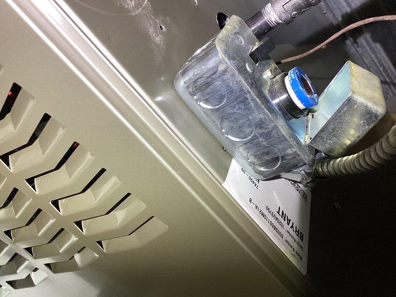 Completed installation of a Bryant furnace in basement utility area, including proper mounting on concrete floor, connection of metal ventilation duct, and installation of filtration system with clear housing. All electrical connections were secured and system was tested for proper operation before completion.