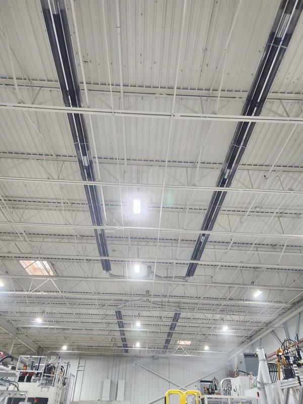 Successfully installed 8 Reznor tube heaters with digital thermostats in commercial facility. All units were properly mounted to industrial ceiling structure with appropriate safety clearances and connected to existing HVAC infrastructure. System was tested and verified operational with all thermostats calibrated for optimal performance.