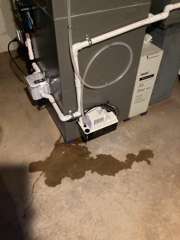 Responded to warranty service call for water leak beneath Trane furnace. Discovered condensate pump malfunction causing water to pool on concrete floor. Replaced defective pump under parts and labor warranty coverage.