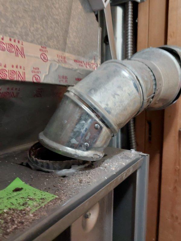 Performed dual furnace maintenance with thorough cleaning of ventilation ducts and exhaust pipes which showed significant dust accumulation at connection points. Inspected flexible ducting and checked exposed insulation in utility area, noting proper function of both heating systems despite debris buildup.