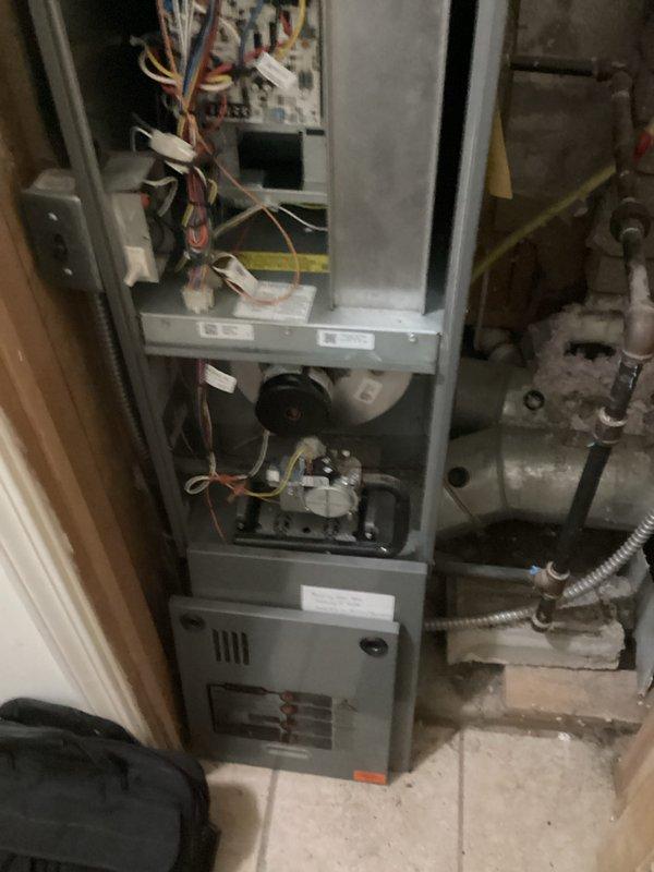 Performed comprehensive assessment of existing HVAC furnace system (Quote #03860-03 and #03859-01) and documented replacement requirements. Inspected electrical control board connections featuring multiple wire harnesses and evaluated blower motor assembly condition. Examined ventilation components including flexible metal ductwork, vent covers, and connection points to ensure proper system integration for the proposed replacement.