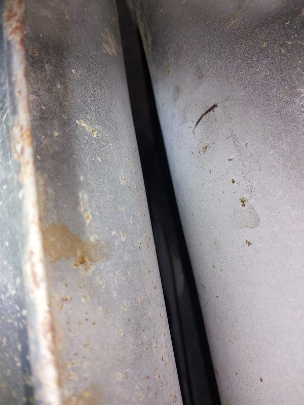 Performed scheduled furnace maintenance service under Worry Free Service Agreement. Inspected heat exchanger and ductwork components, documenting evidence of aging metal surfaces with visible rust formation and mineral deposits. Completed routine tune-up procedures on approximately 2025 CM furnace with age undetermined.