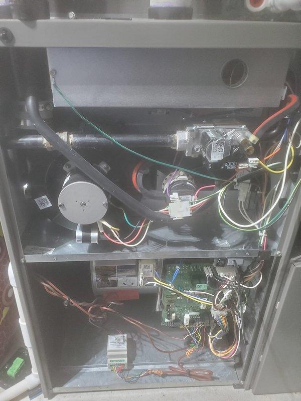 Completed dual-system Lennox furnace maintenance service. Performed comprehensive inspection of internal components including motor, fan assembly, circuit boards, and electrical connections. Removed access panels to examine ventilation system and PVC piping, ensuring proper operation of both heating units.