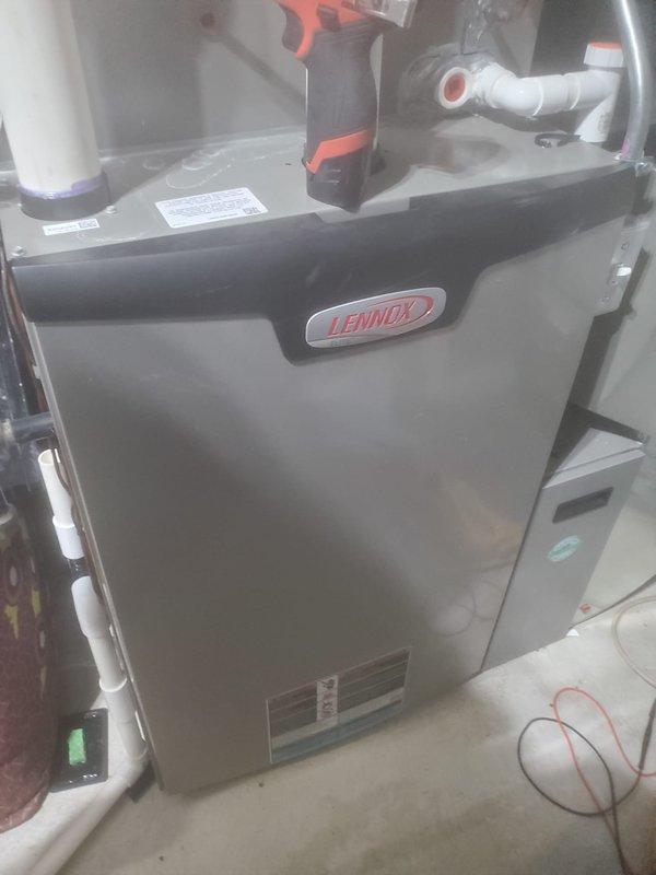 Completed dual-system Lennox furnace maintenance service. Performed comprehensive inspection of internal components including motor, fan assembly, circuit boards, and electrical connections. Removed access panels to examine ventilation system and PVC piping, ensuring proper operation of both heating units.